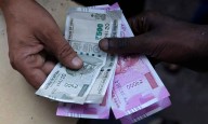 Rupee settles with 2 paise gain at 88.58 against US dollar