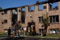 20 years after arsonist torched Flint area apartment complex, teardown gets started