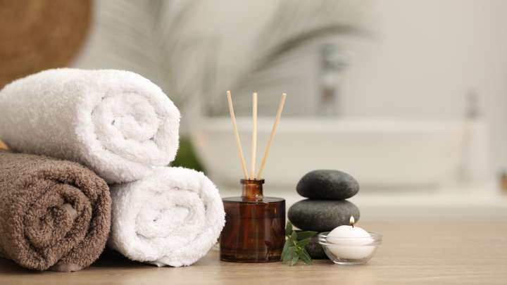 The Affordable Thrift Store Item That Keeps Your Bathroom Towels Organized