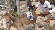 Telangana villagers protest with donkey carrying posters of CM, minister Komatireddy