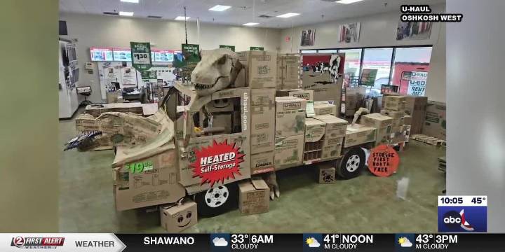 Oshkosh West U-Haul employees build ‘U-Haul-o-saurus Truck’ for Halloween