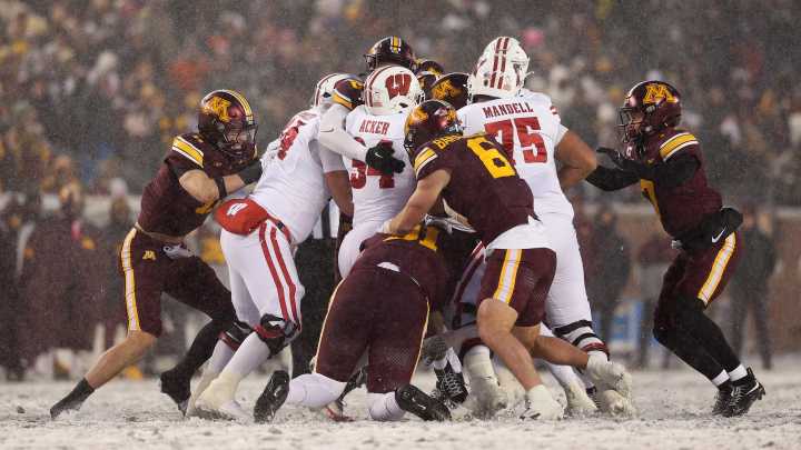 Have questions about the Wisconsin football team and its…