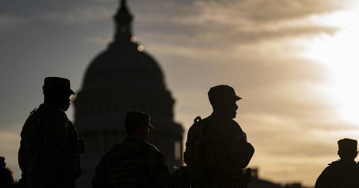 In an encrypted group chat, National Guard members question Trump deployments