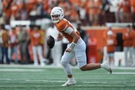 Manning throws 3 touchdowns and No. 20 Texas holds off No. 9 Vanderbilt late for 34