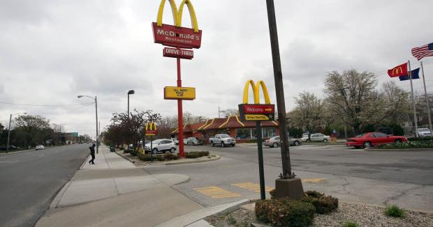 Police aid injured shooting victim at McDonald's restaurant