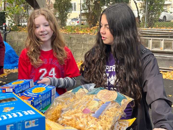 School spirit meets community service as Staten Island students pack meals at food pantry (26 photos)