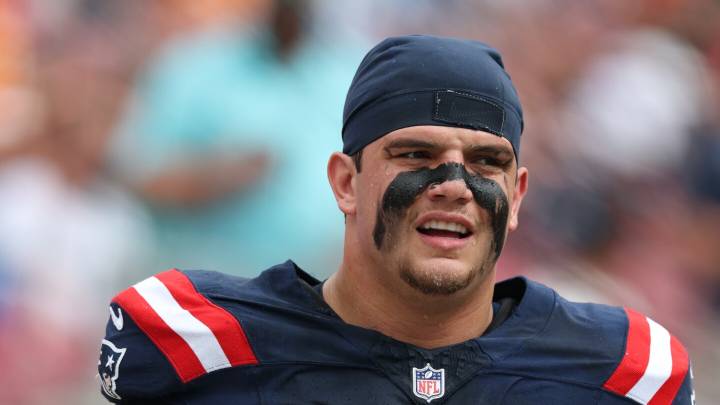 Patriots LT Will Campbell carted off with knee injury