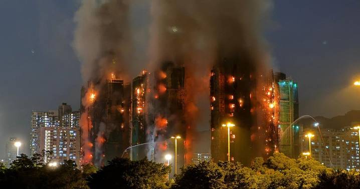 At least 4 dead in blaze in Hong Kong residential high-rise complex with others trapped inside