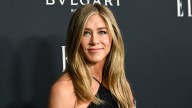 Jennifer Aniston's beau Jim Curtis is a true gent as he quietly slips inside event