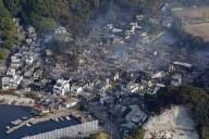 Fire burning in southwestern Japan damages 170 homes and forces evacuations