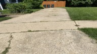The Affordable Tool That Can Fill Cracks In Your Concrete Driveway