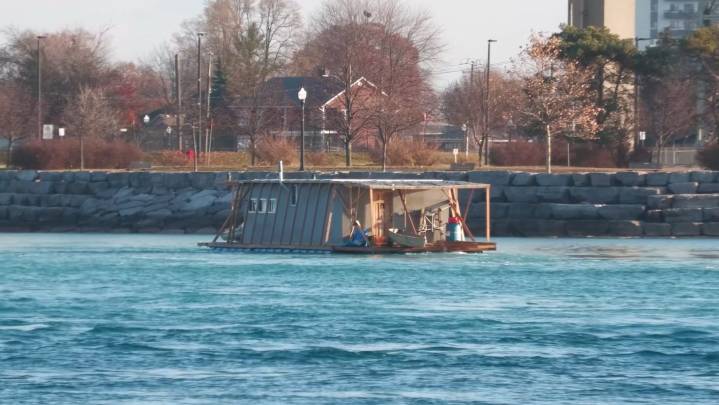 Eyes glued on a small houseboat that navigated the St. Clair River