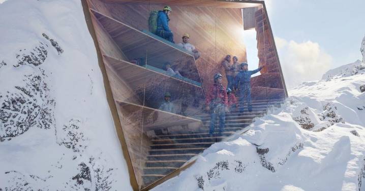 New glass shelter blends right into the rocks of mountain