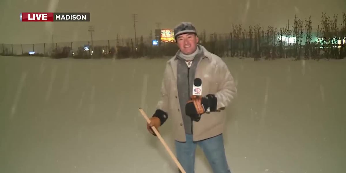 Charlie measures the snow and makes a snow angel
