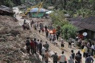 Indonesian rescuers search for survivors as death toll from floods and landslides tops 300