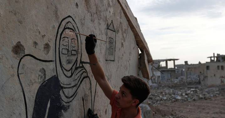 Syrian artists transform bombed-out house into a mural of remembrance, in photos