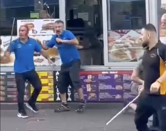 Rivals behind two kebab shops slash each other with metal poles in street brawl