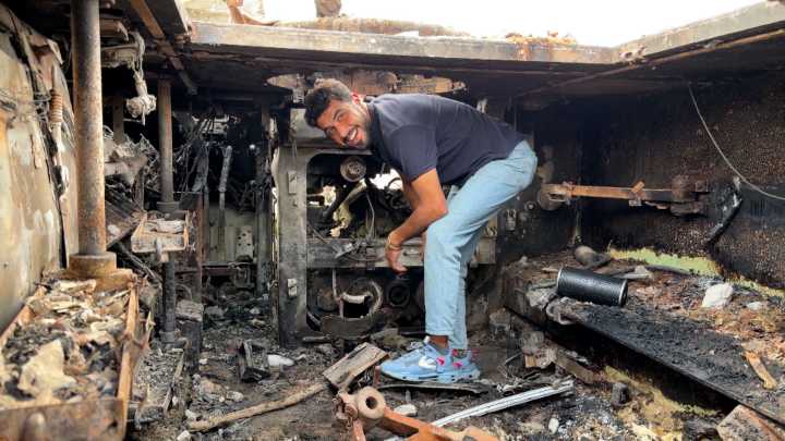 Palestinians use abandoned Israeli vehicle to help supply water in Gaza