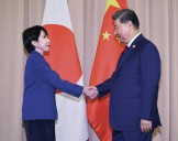 Trump urges Japan leader to avoid escalation in China dispute