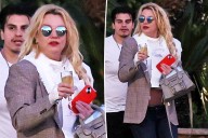 Britney Spears spotted walking to car with champagne flute as family remains concerned over erratic behavior