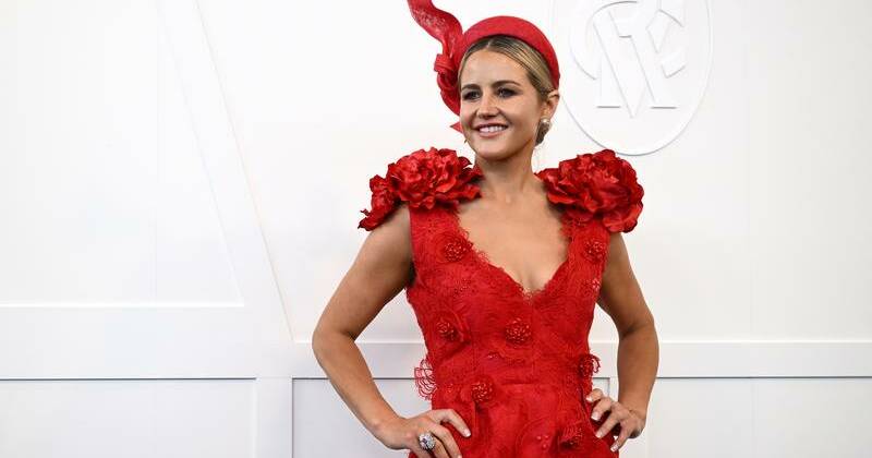 Red hot glamour shines through rainy Melbourne Cup