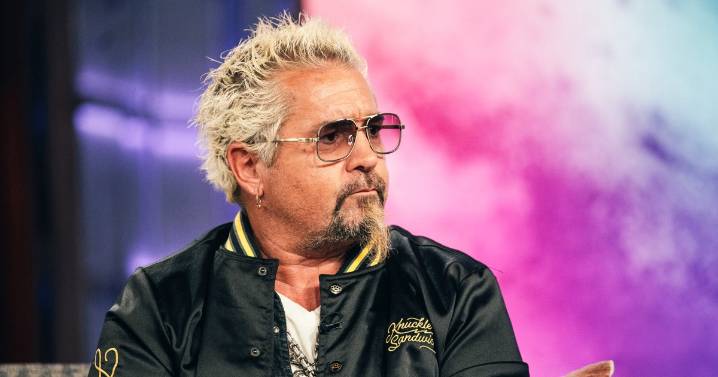 Guy Fieri says his leg 'exploded' after he fell down stairs on set, is now in wheelchair