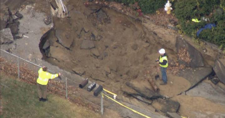 Cleanup underway in Westford after water main break floods homes, collapses road