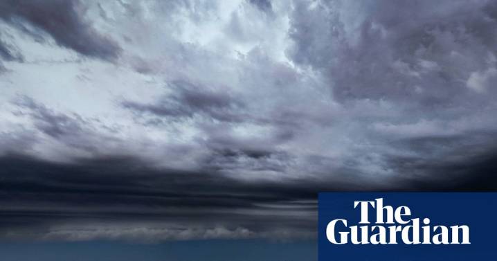 Brisbane storms and hail leave nearly 100,000 without power as trees downed and roofs stripped