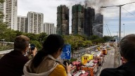 Hong Kong fire death toll rises to 55 as towers burn for 2nd day