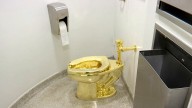 Flush with cash? Fully functional, solid gold toilet sells for $12.1M at auction