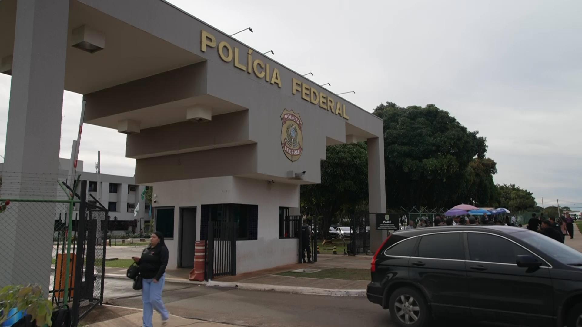 Supporters gather outside police headquarters as Brazil's former President Jair Bolsonaro begins 27