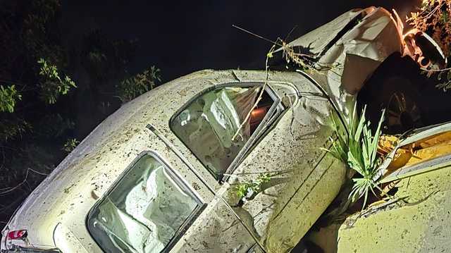 Truck smashes into Melbourne home, part of it ends up on roof