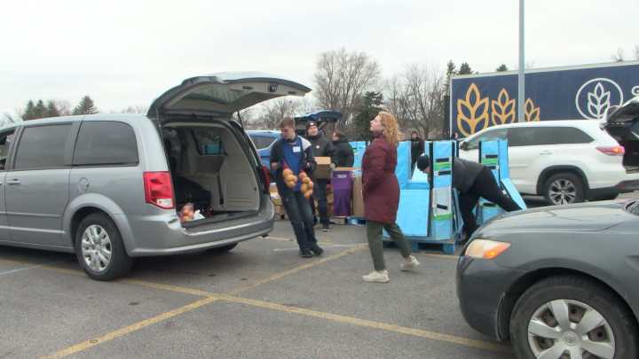 800 families fed in under an hour at Great Plains Food Bank pop