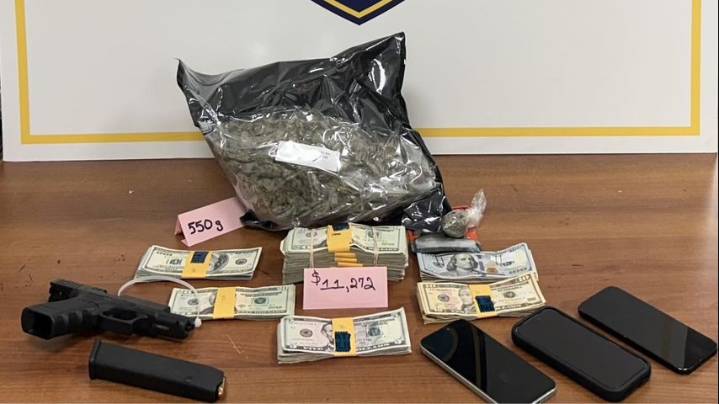 Man arrested after police allegedly find 550 grams of weed, more than $11,000 in his car