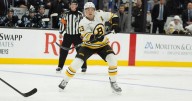 Bruins' Charlie McAvoy exits game against Canadiens after receiving shot to face