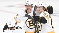 Bruins' Charlie McAvoy hit in the mouth by a slap shot, exits game against Canadiens