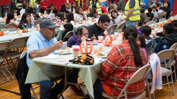 AT&T donates 64 laptops to Maverick families before meal begins