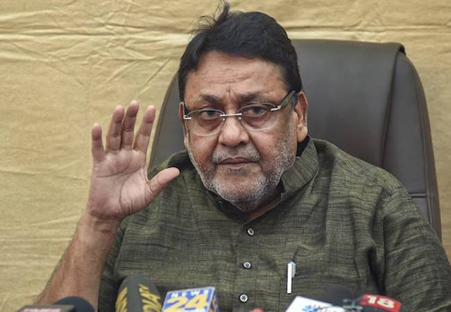 Court frames charges against ex-minister Nawab Malik after he ple...