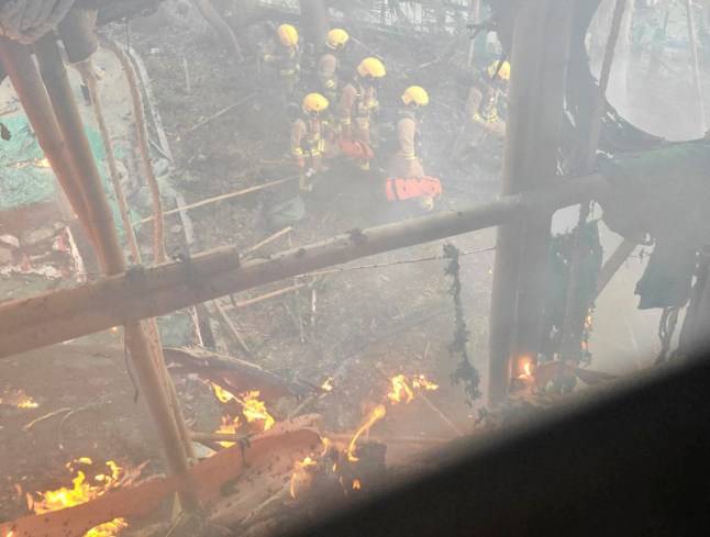 Inside the burning Hong Kong tower blocks as death toll rises to 128 with 200 still missing