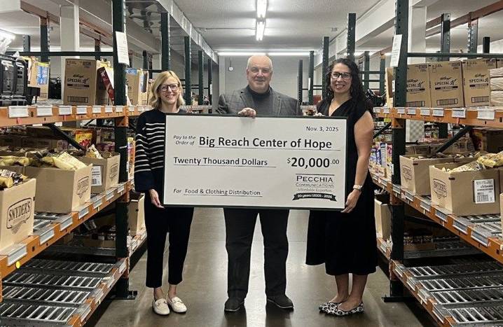 Canfield PR firm marks 20th year with food distribution center donation