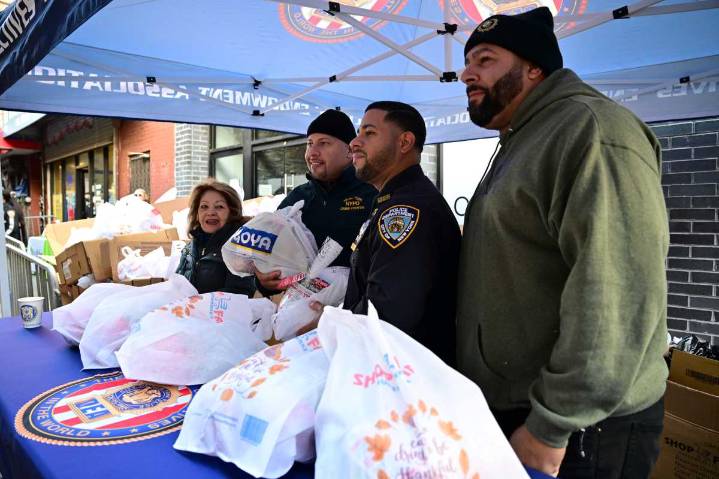 ‘We are all one family’: Cops spread Thanksgiving cheer to North Brooklyn families in need • Brooklyn Paper
