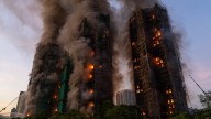 Hong Kong fire that killed at least 55, burns for a second day