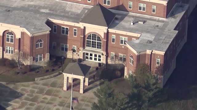 Students protesting as laid off Whitman-Hanson school staff members mark last day