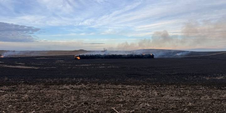 Grass fire burns hay bales in Stutsman County