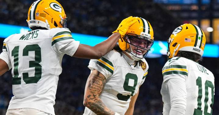 Love matches career high with 4 TD passes, lifting Packers over Lions