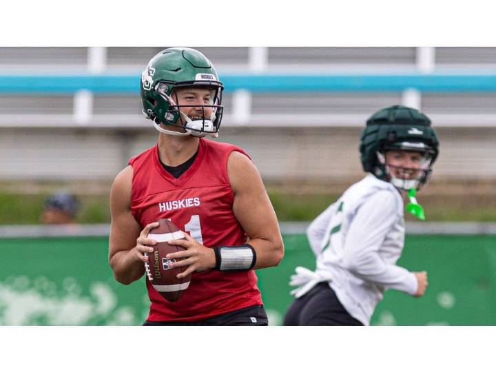 Huskie players keep Anton Amundrud close as they prepare for Bowl game