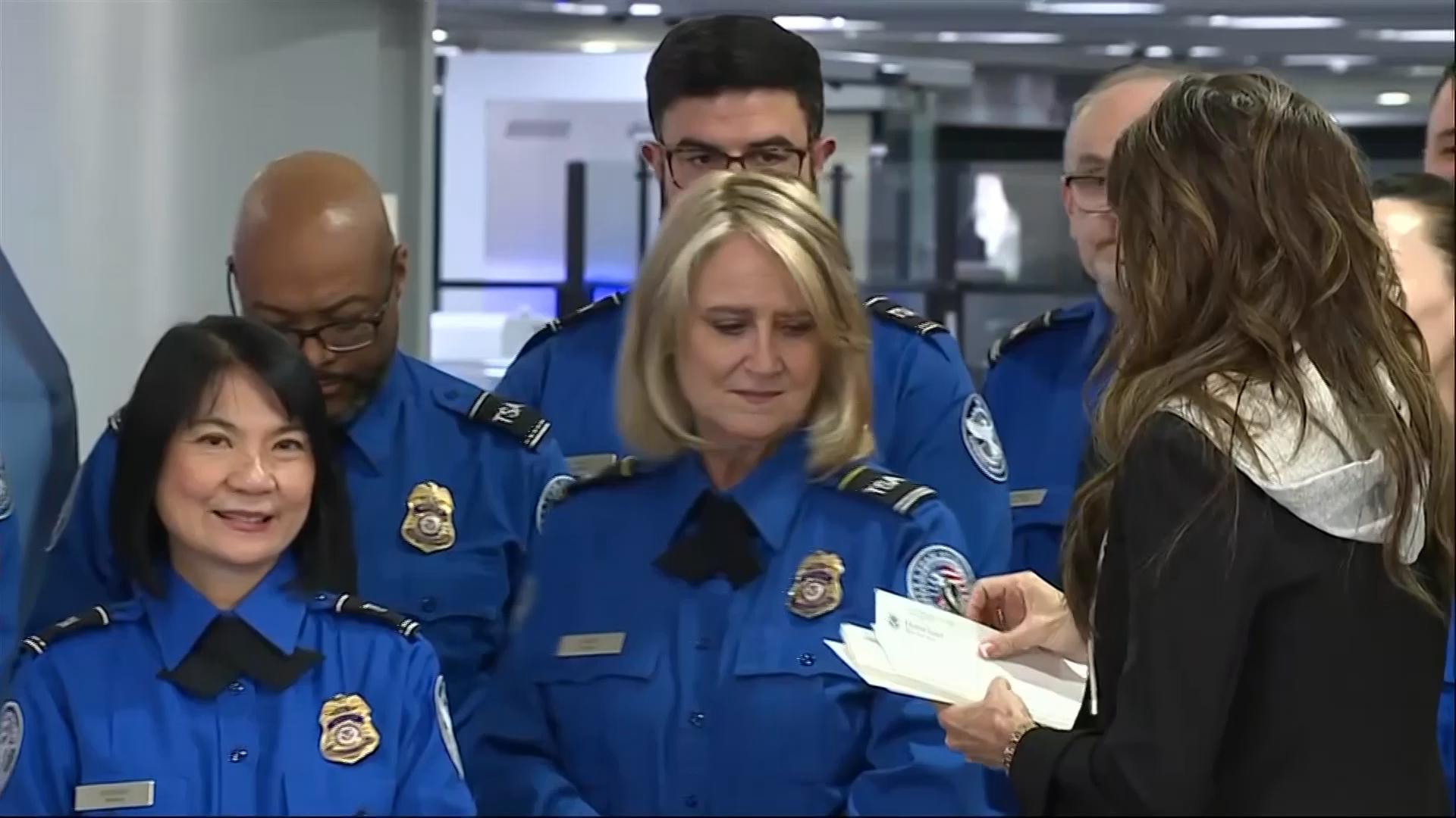Kristi Noem hands out bonus check certificates to airport employees in Las Vegas