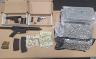 Traffic stop involving stolen vehicle leads to firearms cache