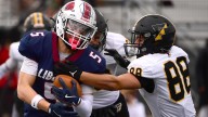 Liberty football battles way into D-11 semifinals with repeat win over rival Freedom