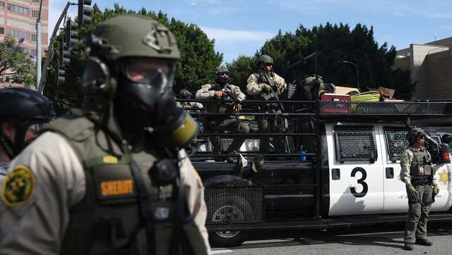 Trump admin sues California over law banning masked federal agents